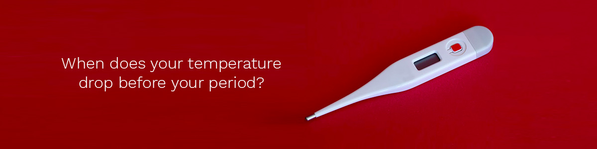 When does your temperature drop before your period?