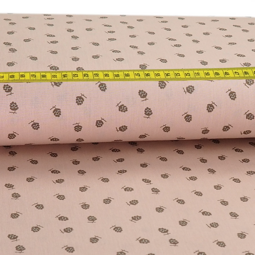 Baumwolle Kleine Tannenzapfen auf Hellrosa