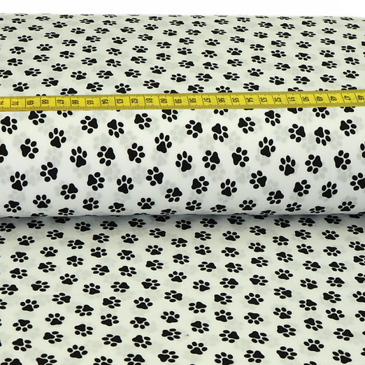 Baumwolle Tierpfoten auf Cremeweiß