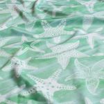 Tissu sport & maillot de bain – impression numérique étoiles de mer menthe UPF50 recyclé