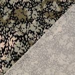 Viskosjersey - Abstrakta blommor grön