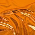 Faschingsstoff - Folienjersey Lamé Uni Orange Faschingsstoff - Folienjersey Lamé Uni Orange