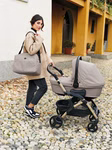 2in1 Fluido Easy Sport-Kinderwagen in stilvollem Design mit umkehrbarem Sitz, großen Hinterrädern und ergonomischem Griff – ideal für Kinder von 0 bis 4 Jahren in beige.