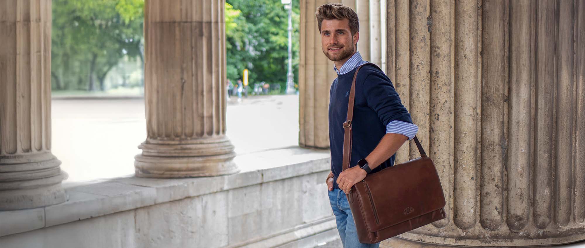 Leather business bag, man in smart casual outfit with brown leather briefcase