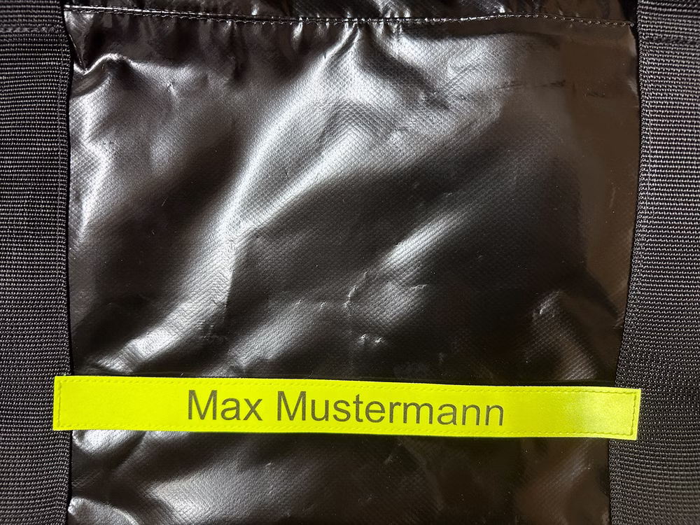 Klettschild mit Beschriftung für Fenomed Bekleidungstasche