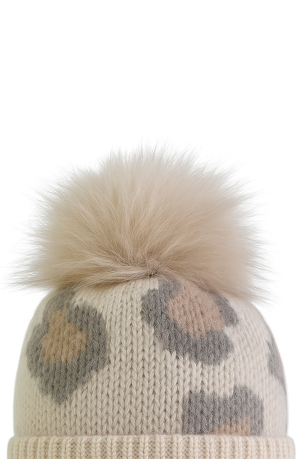 Modische Strickmütze mit Bommel für kalte Tage Modische Strickmütze mit Bommel für kalte Tage