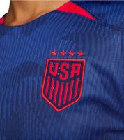 NIKE USA 2023 Women's Away Jersey, a sustainable sports jersey made from recycled materials. Slim-fit shirt with DRI-FIT technology. Soccer shirt DR4000-406 Blue/Red.
