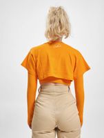 Le haut court Couture Club avec un imprimé gothique superposé en orange Le haut court Couture Club avec un imprimé gothique superposé en orange
