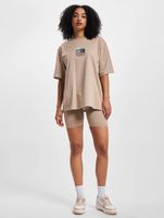 The Couture Club cycling shorts with graphic label and detail in beige