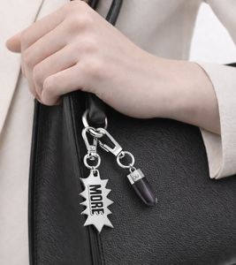 Trendy Calvin Klein Downtown Charm Set - Stainless Steel Pendants with Contrasting Resin and "MORE" Logo - Bag Accessories - 7 x 1.3 cm - KJJCBA090100 - Silver/Black