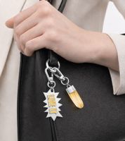 Stylish Calvin Klein Downtown Charm Set: Stainless Steel Pendants with Contrasting Resin and "LIVE IT" Lettering - Bag Accessories - 7 x 1.3 cm - KJJCJA090100 - Silver/Yellow