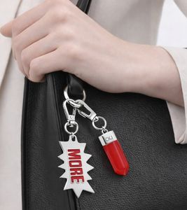 Stylish Calvin Klein Downtown Charm Set - Stainless Steel Pendants with Contrasting Resin and "MORE" Logo - Bag Accessories - 7 x 1.3 cm - KJJCRA090100 - Silver/Red