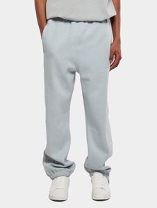Pantalones versátiles para hombre de URBAN CLASSICS con cordón ajustable y bolsillos, algodón de 380 g/m², azul pastel.