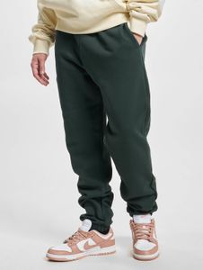 Comfortable Urban Classics men's jeans with drawstring and pockets, 460 g/m² cotton, green