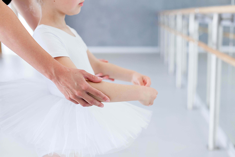 Girl practicing ballet figure