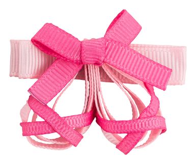 Eine rosa Haarspange in Form von Ballettschuhen mit einer Schleife