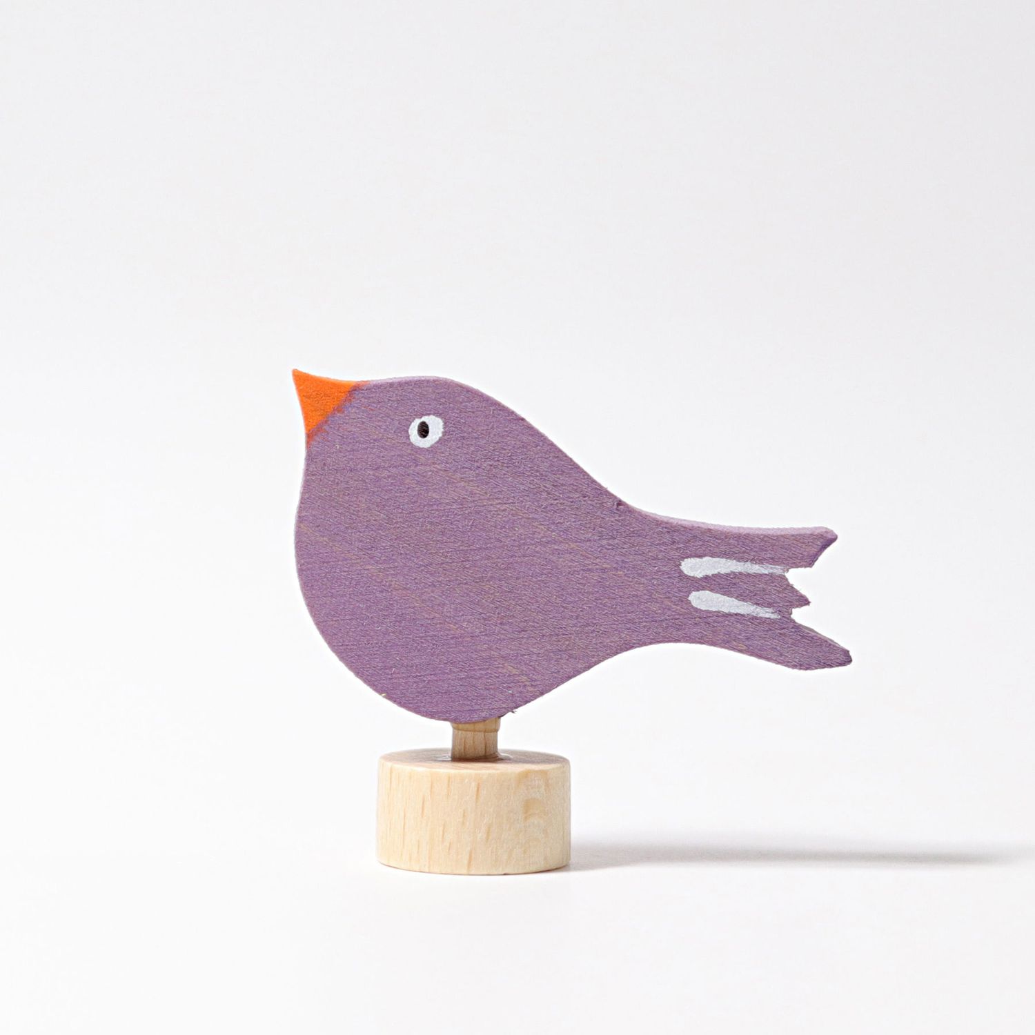 Grimm`s plug figure sitting bird