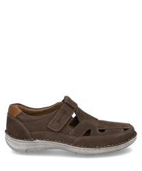 The brown leather shoe features a practical Velcro closure. Special features include the side cut-outs and the light solewhich combine comfort and style.