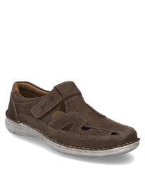 The brown leather shoe features a practical Velcro closure. Special features include the side cut-outs and the light solewhich combine comfort and style.