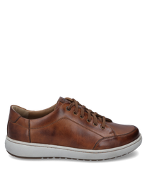 The sneaker in cognac combination features a smooth leather upper with light stitching and a sturdy white rubber sole. Notable features include the brown laces and the subtle seam detailingwhich give the shoe an elegant look.