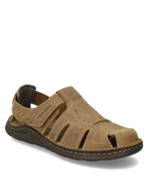 The sandal in the color Castagne is made of high-quality leather and features a practical Velcro closure. It has a sturdy sole and side openings that provide ventilation.