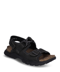 The sandal is made of black leather with striking white stitching. It features a buckle closure and a sturdyprofiled sole for optimal grip.