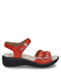 Sandalias rojas de mujer con cierre de velcro hechas de cuero sintético. La suela es negra y ergonómica diseñada para mayor comodidad al caminar.