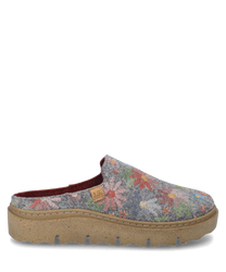 The house slipper is designed in a gray-multi color pattern featuring colorful floral motifs on a soft fabric material. It has no closure and is equipped with a sturdy light brown sole that provides comfort.