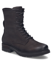 Botte en cuir marron foncé avec lacets. La chaussure a une semelle robuste et un look minimaliste et élégant.