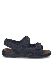 Sandalias de cuero negras con cierre de velcro. Diseño cómodo y resistente ideal para uso diario.
