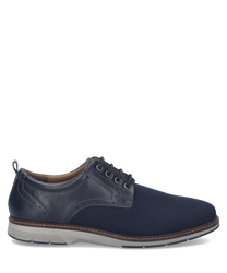 The shoe is a low-cut style with a navy blue leather and mesh upper. It features a lacing closure and a contrasting white and brown sole for a modern touch.