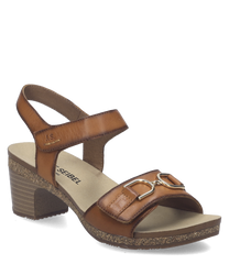 Sandalo in pelle marrone con chiusura in velcro. Tacco medio e dettagli metallici sulla parte frontale