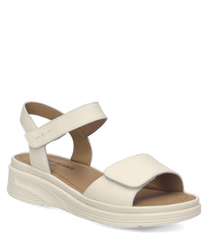 Sandales en cuir blanc avec fermeture Velcro. Semelle épaisse et confortable pour un soutien optimal.