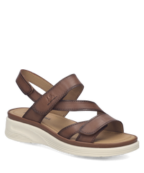 Sandalias de cuero marrón con cierre de velcro. Suela blanca gruesa para mayor comodidad.