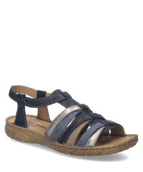 Sandalias de cuero azul y blanco con cierre de velcro. Suela marrón texturizada para un mejor agarre.
