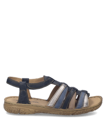 Sandalias de cuero azul y blanco con cierre de velcro. Suela marrón texturizada para un mejor agarre.