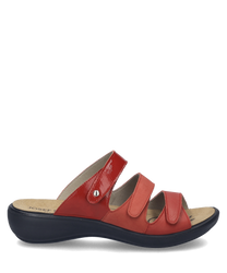 Sandalias rojas con cierre de velcro. Hechas de material sintético con suela negra ergonómica.
