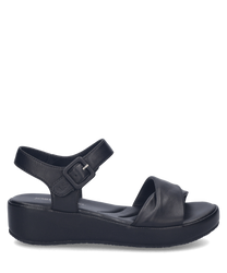 Black sandals featuring a Velcro closure with a sleek synthetic leather finish. The sandals have a comfortable cushioned sole and an adjustable strap for a secure fit.