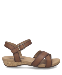 Sandalo marrone in pelle con chiusura in velcro. Suola in sughero per un comfort ottimale.