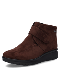 Braune Stiefelette aus Wildleder mit Klettverschluss. Robuste schwarze Sohle für optimalen Halt.