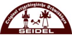 Logo mit Schriftzug Original Erzgebirgische Volkskunst Seidel rotes Halbkreis Symbol mit Figuren und gekreuzten Werkzeugen darunter Schriftzug Seidel