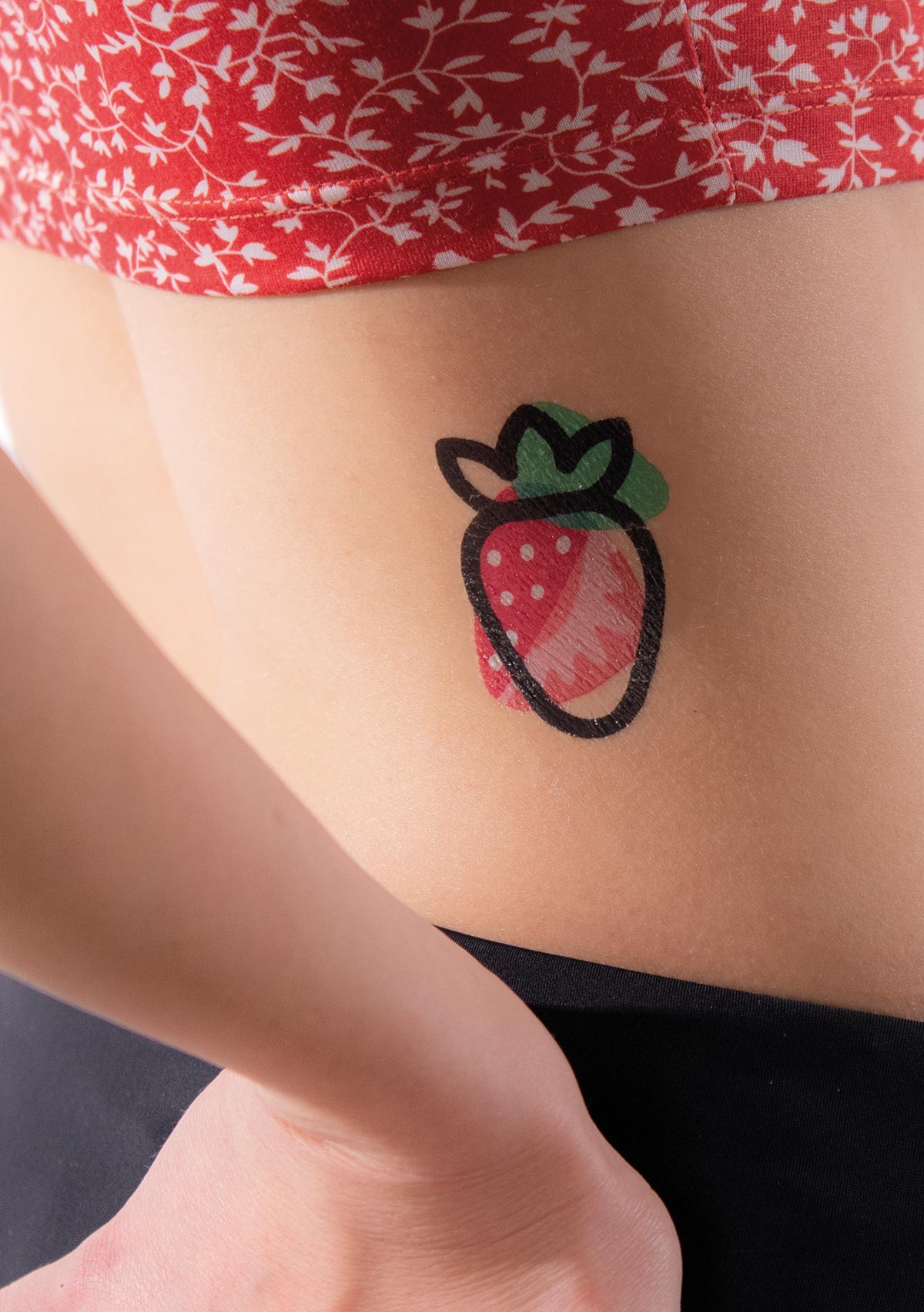 Cute strawberry tattoo on the wrist - Tattoogrid.net