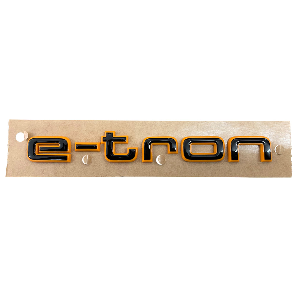 Original Audi Black Edition quattro Emblem Schriftzug Logo Emblem in Schwarz / Orange glänzend für das Heck / Hinten selbstklebend